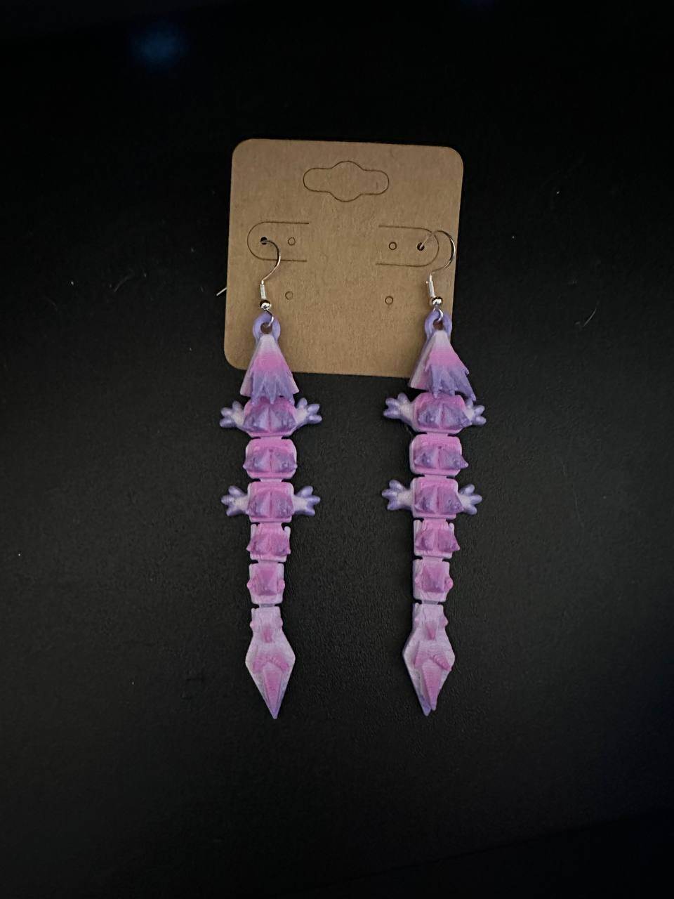 purplish pink articulated dragon earrings